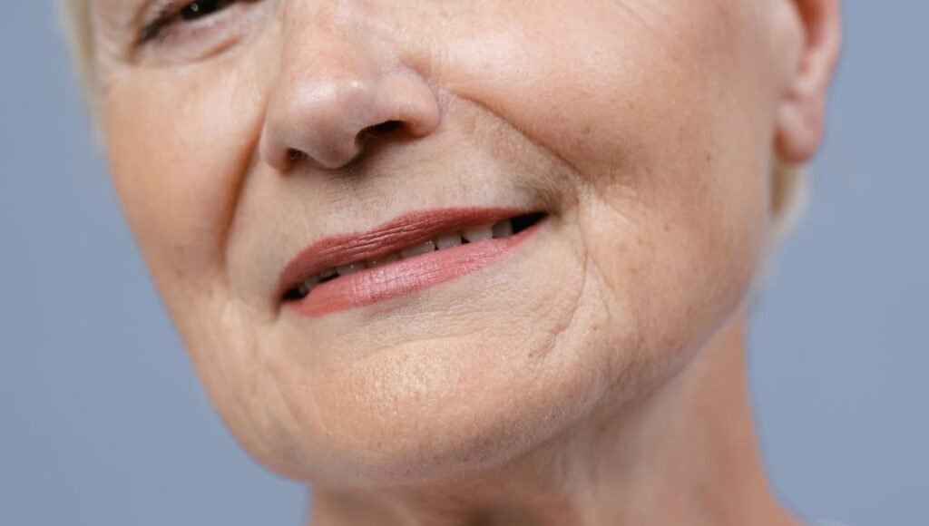 Sagging skin on an older woman’s face, linked to vitamin deficiency and treatable with homemade skin tightening remedies.